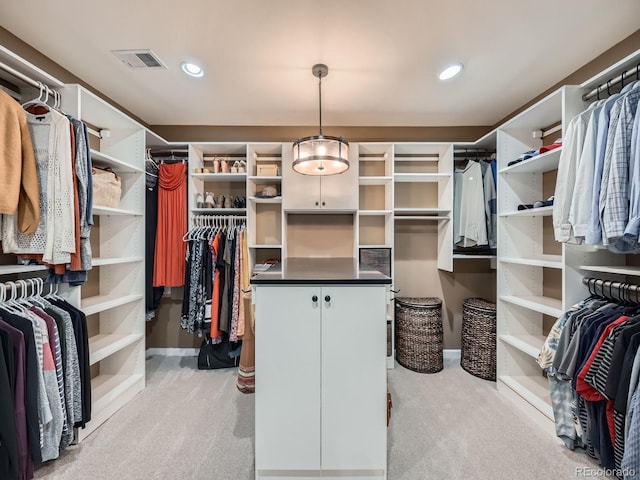 spacious closet featuring light carpet and visible vents