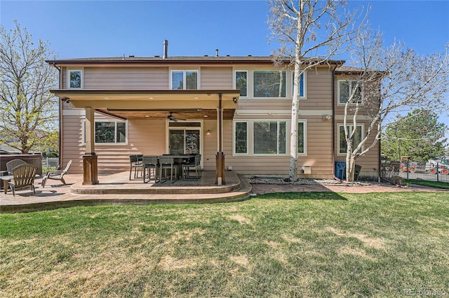 back of house with a yard, fence, and a patio area