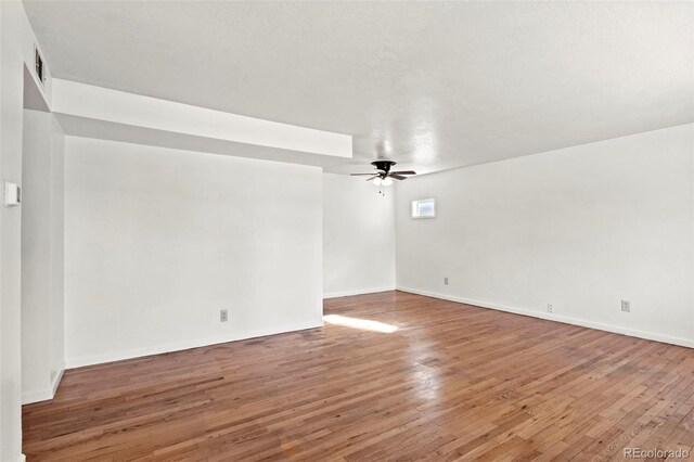 2613 Wren Dr, Colorado Springs, CO 80909 - unfurnished room featuring visible vents, baseboards, a ceiling fan, and hardwood / wood-style flooring