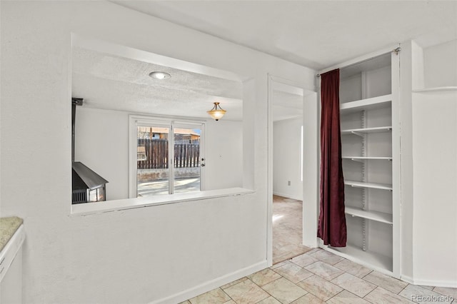 2613 Wren Dr, Colorado Springs, CO 80909 - interior space featuring baseboards and a textured ceiling