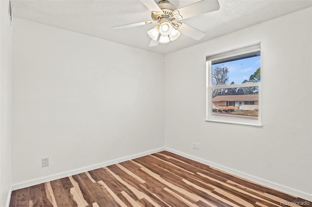 2613 Wren Dr, Colorado Springs, CO 80909 - unfurnished room with wood finished floors, baseboards, and a ceiling fan