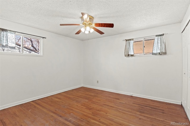 2613 Wren Dr, Colorado Springs, CO 80909 - unfurnished room featuring ceiling fan, baseboards, wood finished floors, and a textured ceiling