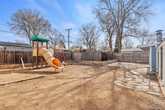 2613 Wren Dr, Colorado Springs, CO 80909 - view of play area with a fenced backyard and a patio area