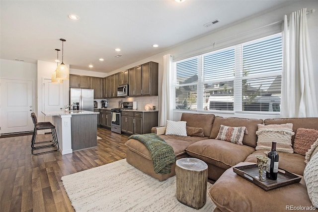 living room featuring dark wood-type flooring