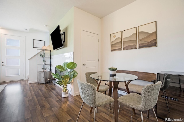 dining space with dark hardwood / wood-style floors