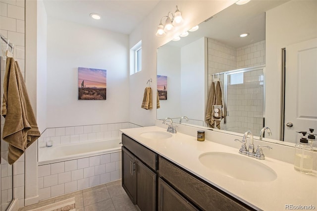 bathroom featuring tile patterned floors, vanity, and plus walk in shower