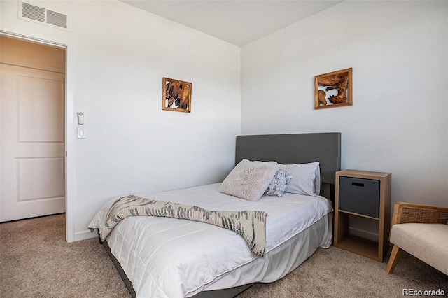 bedroom featuring light carpet