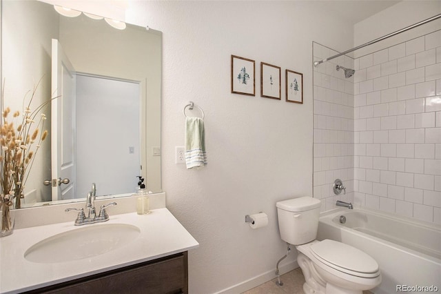 full bathroom featuring vanity, tiled shower / bath combo, and toilet