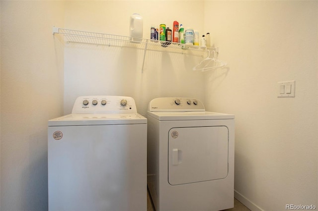 laundry room with washing machine and clothes dryer