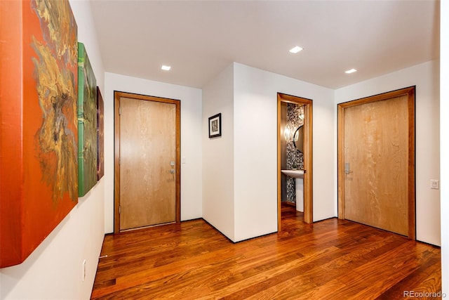 32651 Buffalo Creek Rd, Evergreen, CO 80439 - hall featuring wood finished floors and recessed lighting