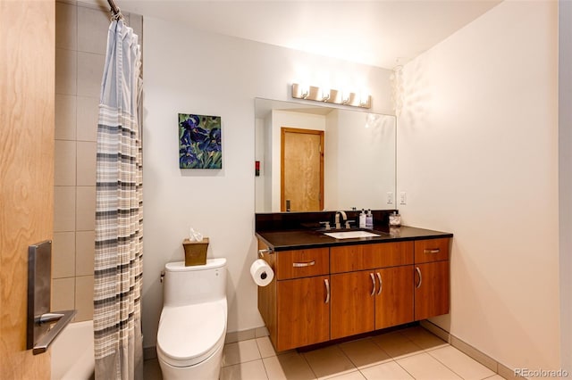 32651 Buffalo Creek Rd, Evergreen, CO 80439 - bathroom featuring toilet, vanity, tile patterned flooring, and baseboards
