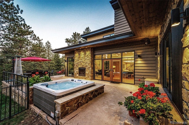 32651 Buffalo Creek Rd, Evergreen, CO 80439 - view of patio featuring an outdoor hot tub and french doors
