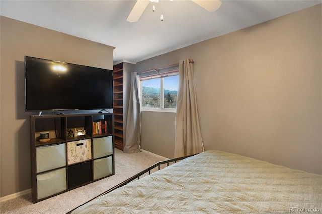 bedroom featuring ceiling fan and carpet floors