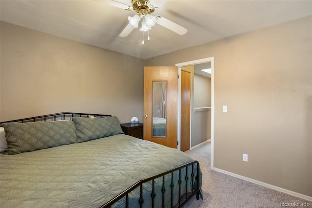 bedroom with ceiling fan and light colored carpet