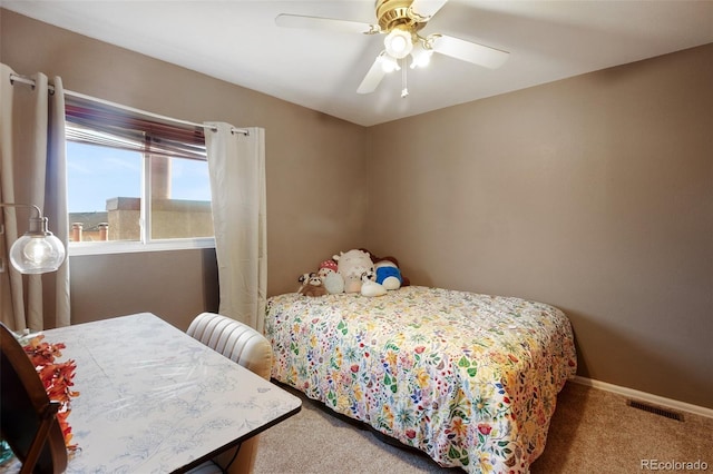 carpeted bedroom with ceiling fan