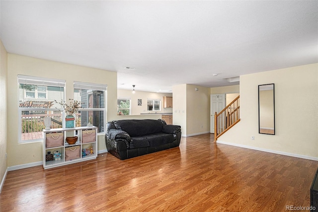 9633 Marmot Ridge Cir, Littleton, CO 80125 - living area with wood finished floors and stairs