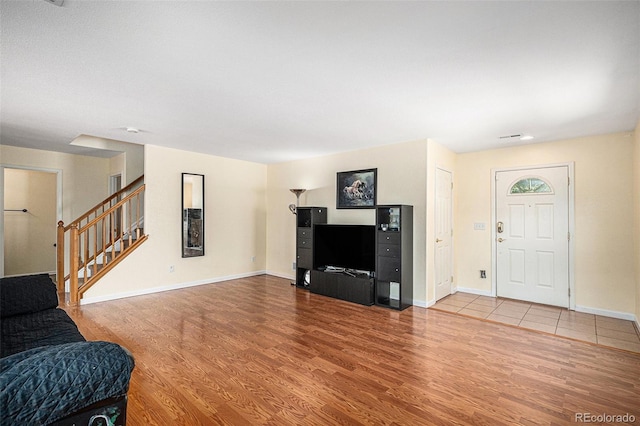 9633 Marmot Ridge Cir, Littleton, CO 80125 - living room featuring wood finished floors and stairs