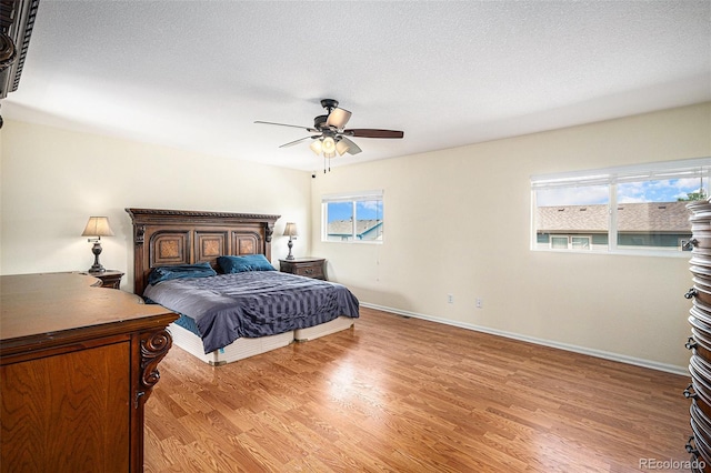 9633 Marmot Ridge Cir, Littleton, CO 80125 - bedroom with light wood-type flooring and a ceiling fan