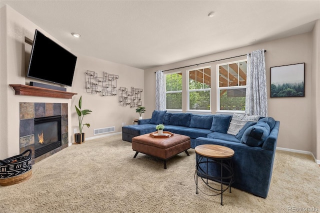 24702 E Ontario Dr, Aurora, CO 80016 - living room featuring carpet floors, baseboards, and a tiled fireplace