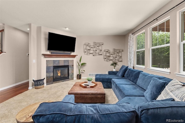 24702 E Ontario Dr, Aurora, CO 80016 - living area with baseboards, a fireplace, and wood finished floors