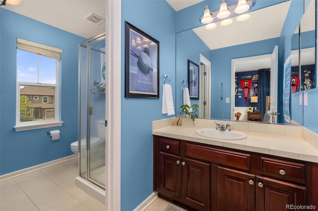 24702 E Ontario Dr, Aurora, CO 80016 - full bathroom with vanity, a stall shower, toilet, baseboards, and tile patterned floors