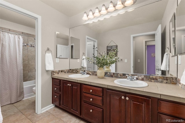 24702 E Ontario Dr, Aurora, CO 80016 - full bathroom featuring double vanity, tile patterned flooring, toilet, and shower / bathtub combination with curtain