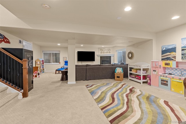 24702 E Ontario Dr, Aurora, CO 80016 - rec room featuring carpet floors, a tile fireplace, baseboards, and recessed lighting