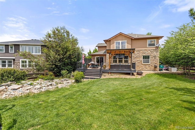 24702 E Ontario Dr, Aurora, CO 80016 - back of house with stone siding, a deck, and a yard