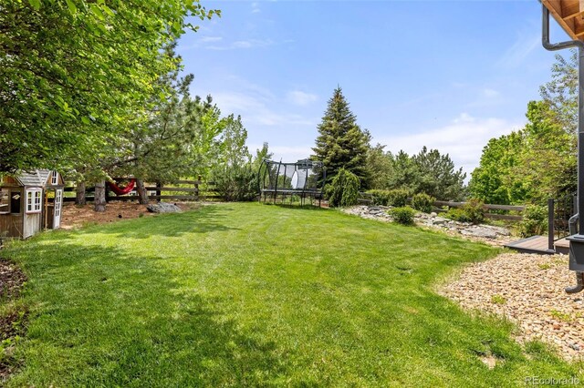 24702 E Ontario Dr, Aurora, CO 80016 - view of yard with a trampoline