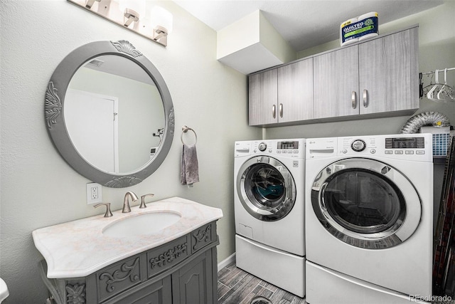 72 Rudi Ln W, Golden, CO 80403 - laundry room with cabinet space, washing machine and dryer, and wood finished floors
