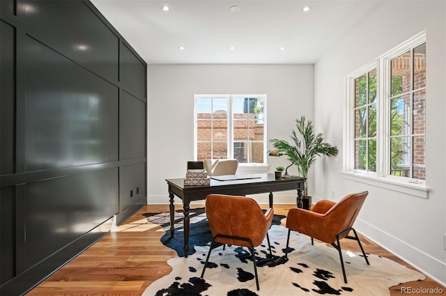 office space with light wood-type flooring