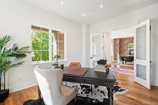 office space with light wood-type flooring