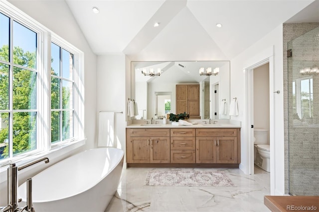 full bathroom featuring vanity, separate shower and tub, toilet, a chandelier, and plenty of natural light