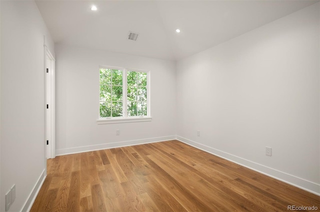 spare room featuring light hardwood / wood-style flooring