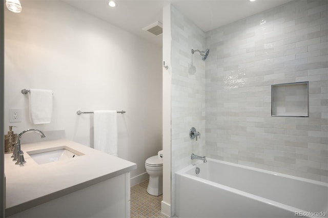 full bathroom with tile patterned flooring, vanity, toilet, and tiled shower / bath