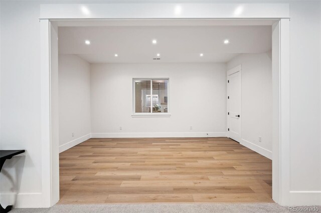 spare room featuring light hardwood / wood-style flooring