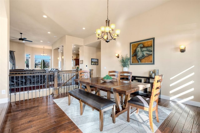 dining room featuring recessed lighting, baseboards, wood finished floors, and ceiling fan with notable chandelier