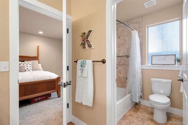 ensuite bathroom with visible vents, baseboards, ensuite bath, shower / bath combo, and toilet