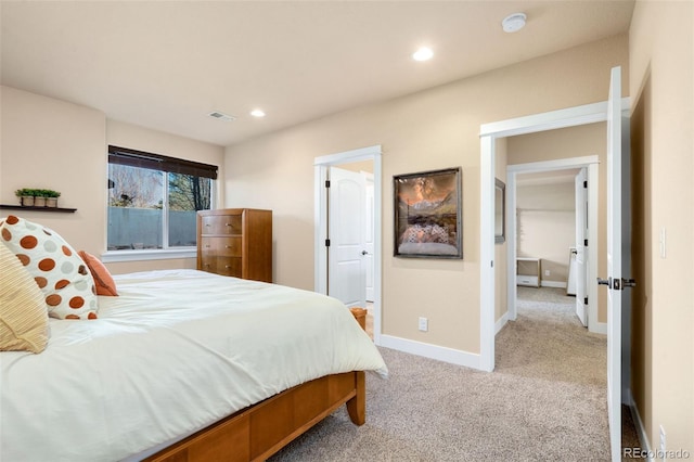 carpeted bedroom featuring recessed lighting, visible vents, baseboards, and ensuite bathroom