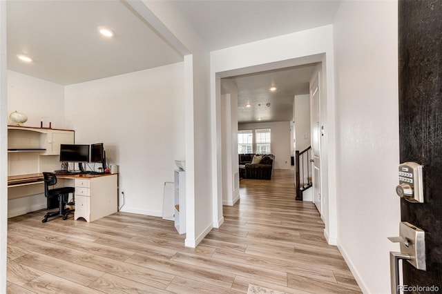 960 S De Gaulle Ct, Aurora, CO 80018 - office area featuring light wood finished floors, baseboards, recessed lighting, and built in desk