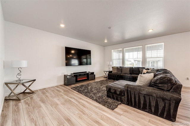 960 S De Gaulle Ct, Aurora, CO 80018 - living room with wood finished floors, baseboards, and recessed lighting