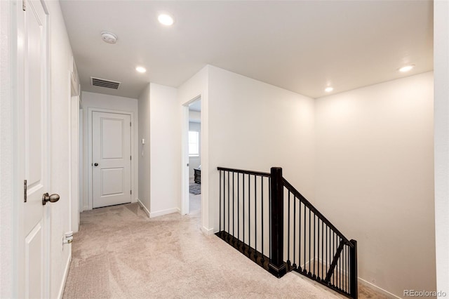 960 S De Gaulle Ct, Aurora, CO 80018 - hall featuring an upstairs landing, carpet flooring, baseboards, and recessed lighting