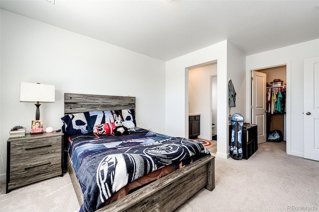 960 S De Gaulle Ct, Aurora, CO 80018 - bedroom with light colored carpet, baseboards, a walk in closet, and connected bathroom