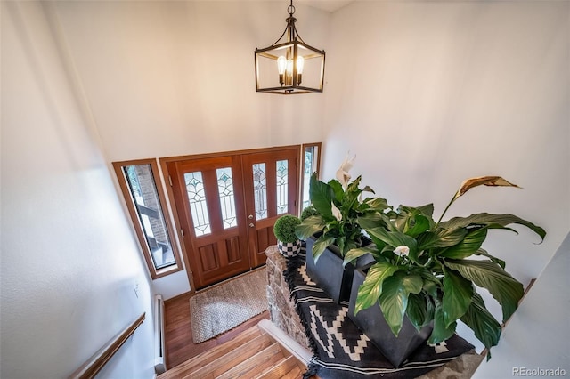 7815 Armadillo Trl, Evergreen, CO 80439 - entryway with an inviting chandelier and wood finished floors