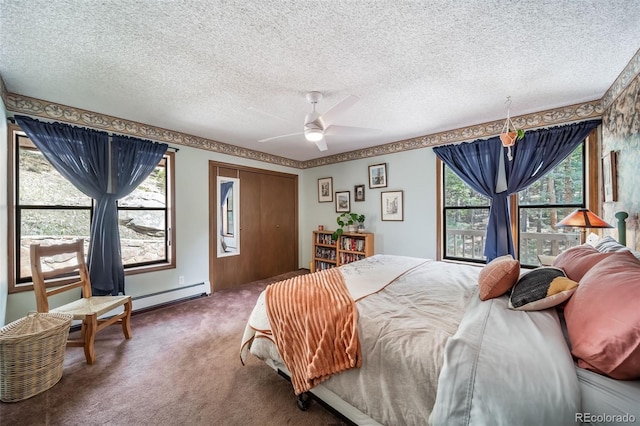 7815 Armadillo Trl, Evergreen, CO 80439 - bedroom featuring a baseboard radiator, carpet floors, a ceiling fan, and a textured ceiling