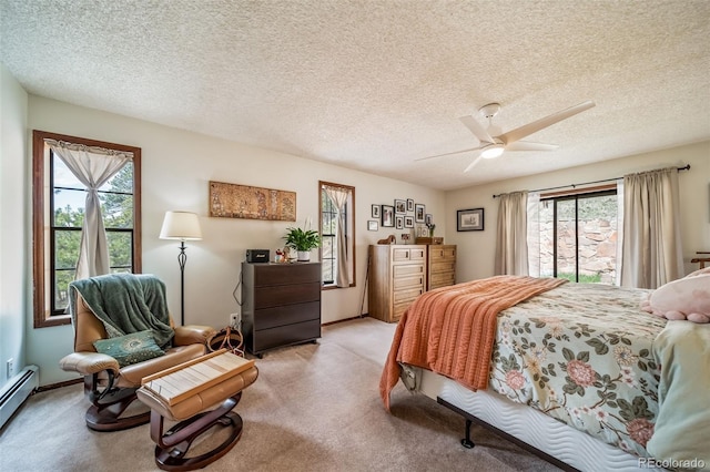 7815 Armadillo Trl, Evergreen, CO 80439 - bedroom with a baseboard radiator, ceiling fan, a textured ceiling, and light colored carpet