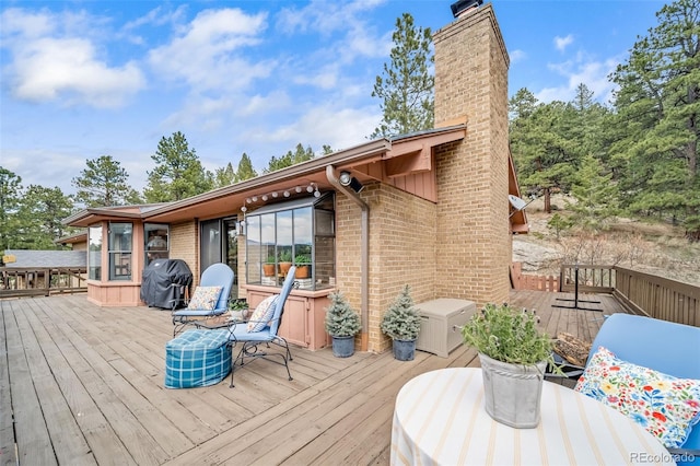 7815 Armadillo Trl, Evergreen, CO 80439 - wooden deck featuring a grill