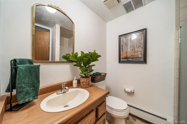 7815 Armadillo Trl, Evergreen, CO 80439 - full bathroom with a baseboard heating unit, toilet, vanity, and visible vents