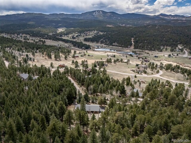 7815 Armadillo Trl, Evergreen, CO 80439 - aerial view featuring a mountain view and a wooded view