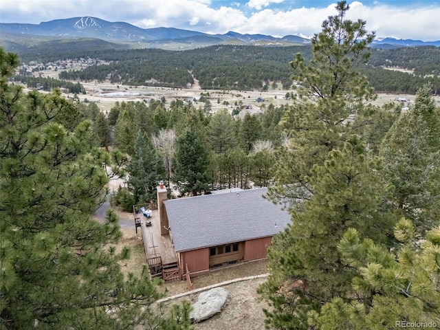 7815 Armadillo Trl, Evergreen, CO 80439 - drone / aerial view with a wooded view and a mountain view